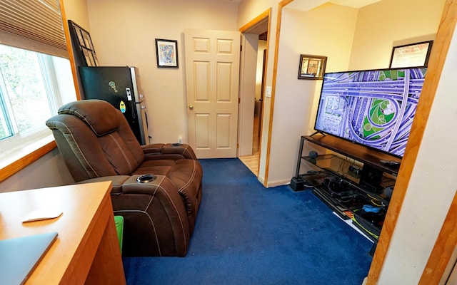 living area with carpet flooring