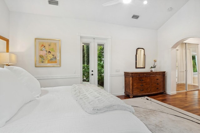 bedroom with ceiling fan, access to exterior, and dark hardwood / wood-style floors