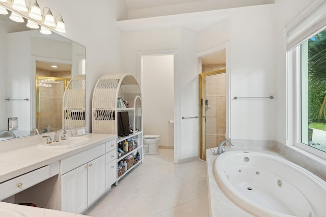 full bathroom featuring toilet, shower with separate bathtub, a healthy amount of sunlight, tile patterned floors, and vanity