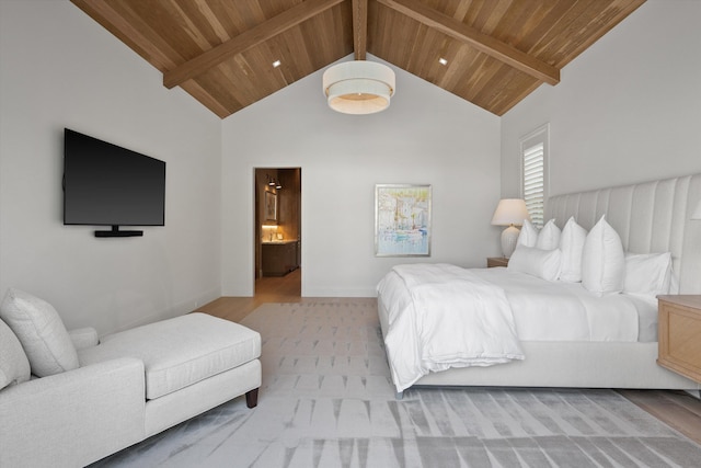 bedroom with beam ceiling, wooden ceiling, high vaulted ceiling, and ensuite bath