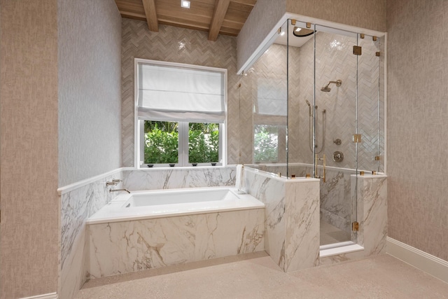 bathroom with plus walk in shower, beamed ceiling, and wooden ceiling