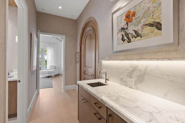 bathroom featuring wood-type flooring and vanity