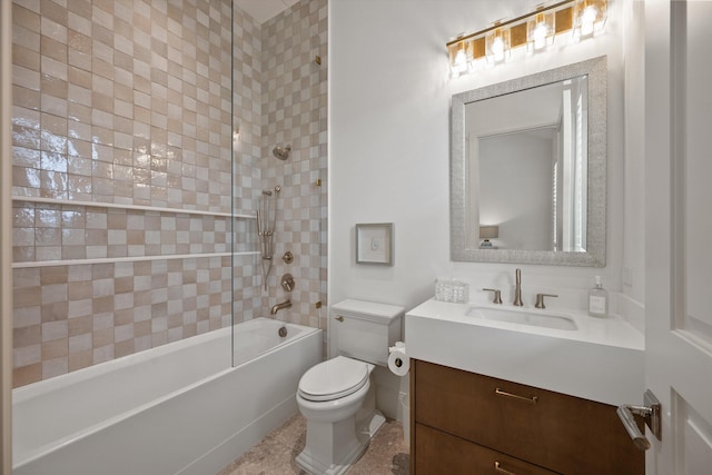 full bathroom featuring vanity, toilet, and tiled shower / bath