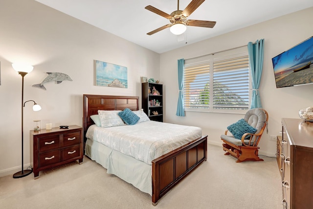 1 Harbour Isle Dr E Unit Ph2, Hutchinson Island, FL 34949 - bedroom featuring light carpet, baseboards, and a ceiling fan