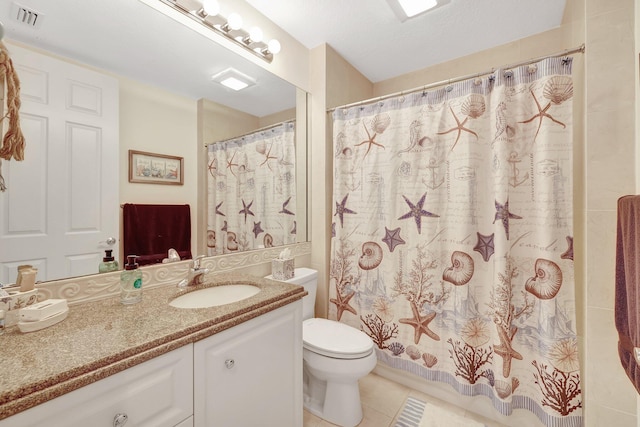 1 Harbour Isle Dr E Unit Ph2, Hutchinson Island, FL 34949 - bathroom with vanity, tile patterned flooring, toilet, and a shower with shower curtain