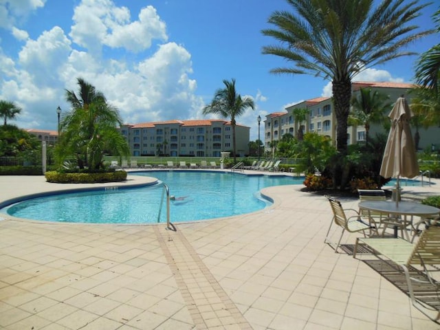 1 Harbour Isle Dr E Unit Ph2, Hutchinson Island, FL 34949 - community pool with a patio