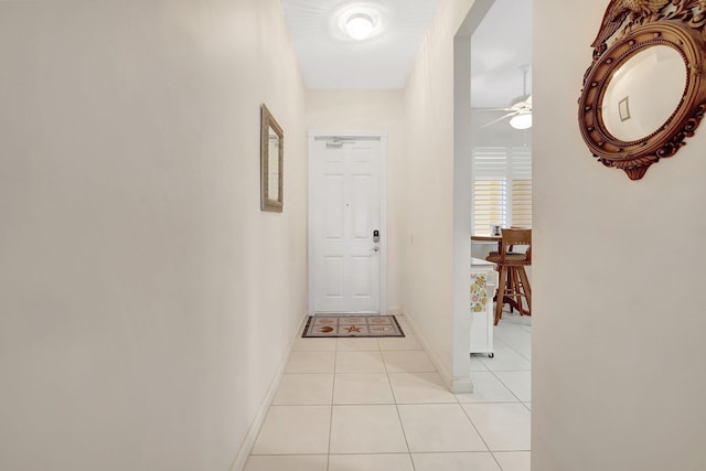 hall with light tile patterned floors