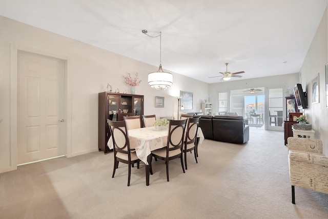1 Harbour Isle Dr E Unit Ph2, Hutchinson Island, FL 34949 - dining space featuring light colored carpet and ceiling fan