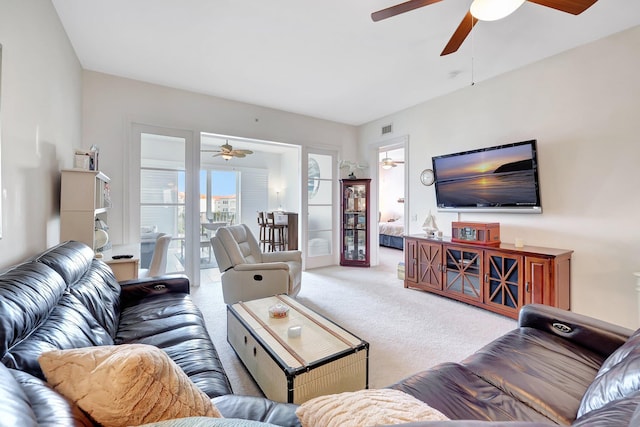 1 Harbour Isle Dr E Unit Ph2, Hutchinson Island, FL 34949 - living area featuring ceiling fan and carpet flooring