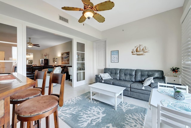 1 Harbour Isle Dr E Unit Ph2, Hutchinson Island, FL 34949 - living room featuring ceiling fan, light tile patterned floors, and built in shelves