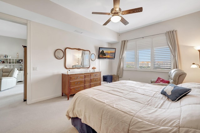 bedroom with light carpet and ceiling fan