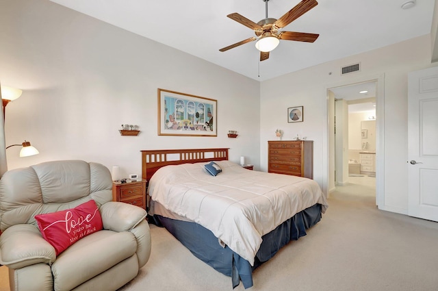 carpeted bedroom with ceiling fan and ensuite bathroom