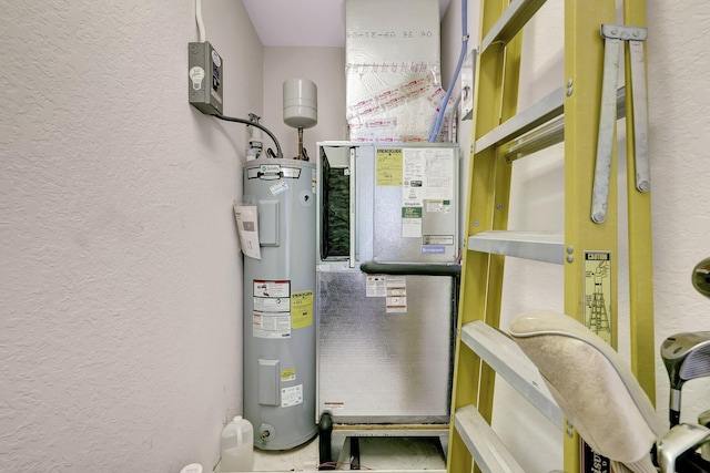 1 Harbour Isle Dr E Unit Ph2, Hutchinson Island, FL 34949 - utility room with electric water heater