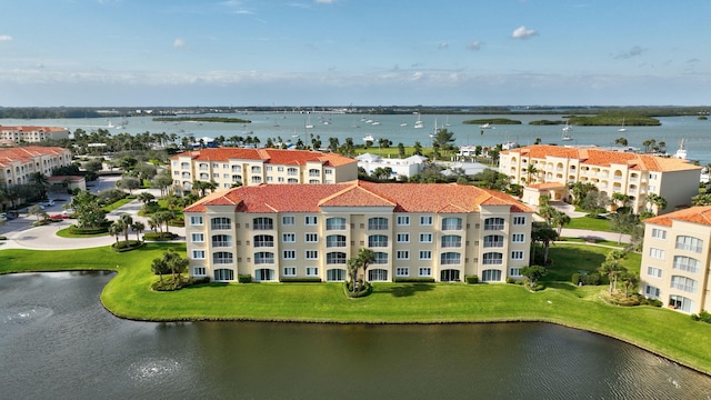 birds eye view of property with a water view