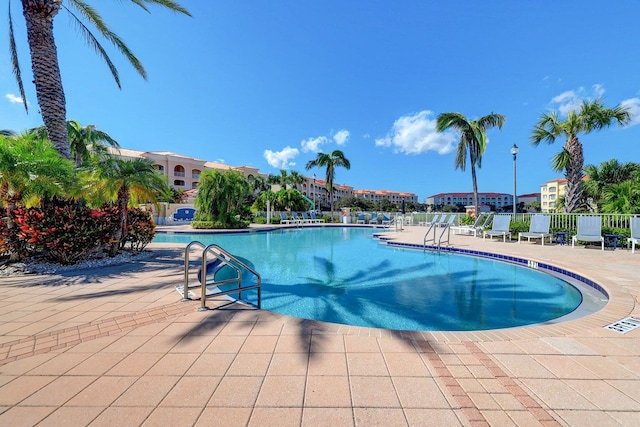1 Harbour Isle Dr E Unit Ph2, Hutchinson Island, FL 34949 - community pool featuring a patio