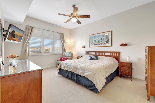 bedroom with ceiling fan and light colored carpet