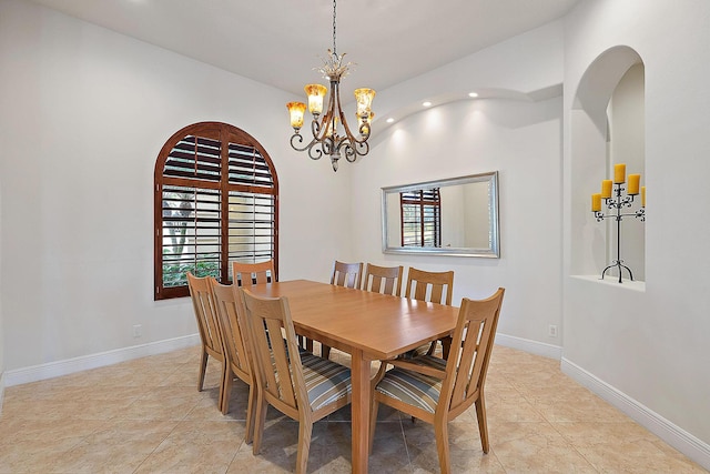 dining space featuring a healthy amount of sunlight, baseboards, arched walkways, and recessed lighting