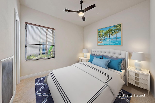 bedroom featuring a ceiling fan and baseboards