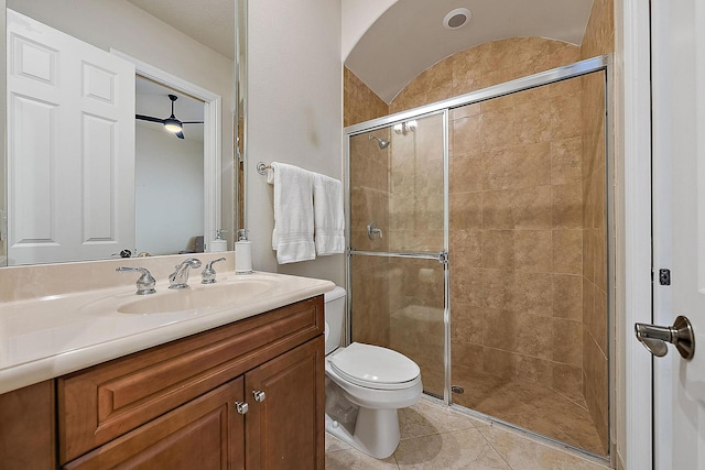 full bathroom with tile patterned flooring, a shower stall, and toilet