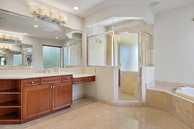 bathroom featuring visible vents, a garden tub, a shower stall, and vanity