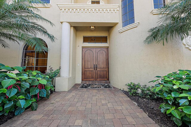 rear view of house with a patio area, a balcony, ceiling fan, and a lawn