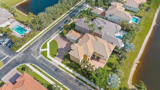 birds eye view of property with a water view