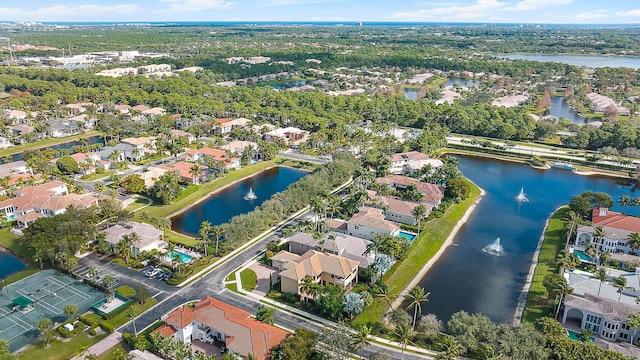 drone / aerial view with a residential view and a water view