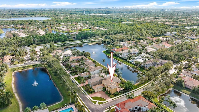 birds eye view of property with a residential view and a water view