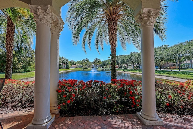 view of swimming pool with a water view