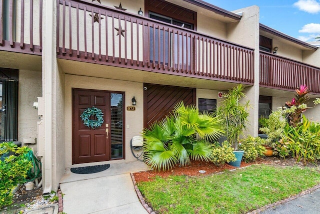 property entrance with a balcony