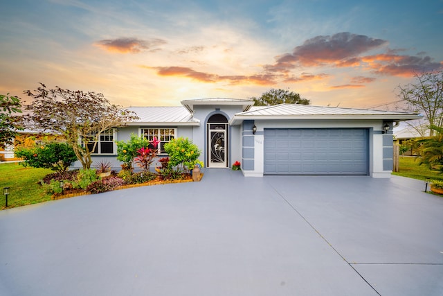 ranch-style house featuring a garage