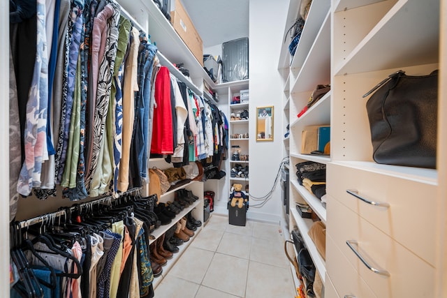 walk in closet featuring light tile patterned floors