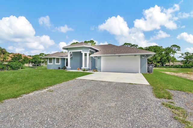 view of front of home featuring a front lawn and a garage