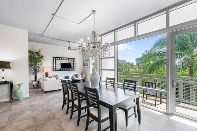 dining space with a notable chandelier and expansive windows