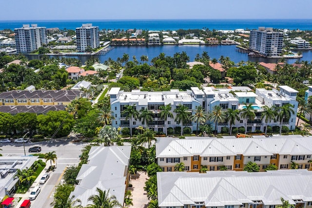 birds eye view of property with a water view