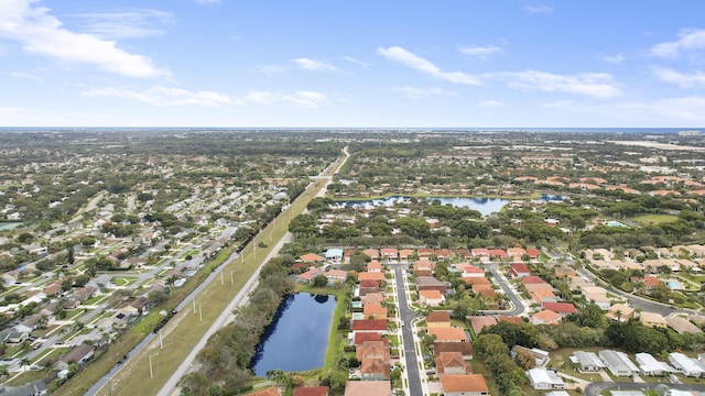 bird's eye view featuring a water view and a residential view