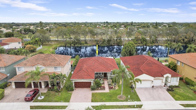 drone / aerial view featuring a water view and a residential view