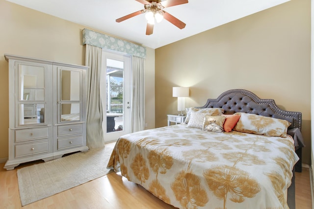 bedroom featuring a ceiling fan, access to outside, and light wood-style flooring