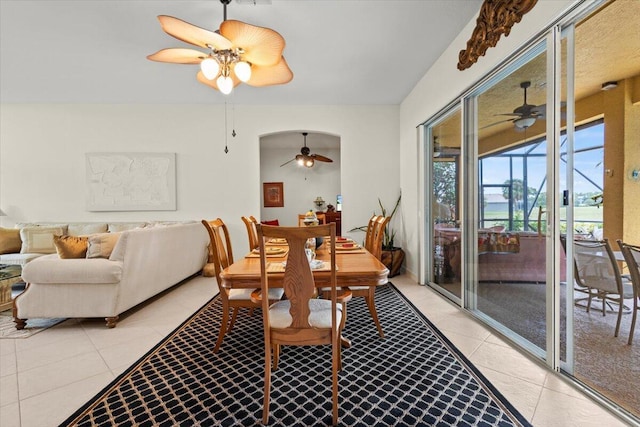 tiled dining area with ceiling fan