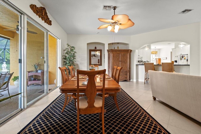 tiled dining room featuring ceiling fan