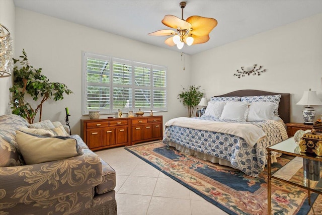 tiled bedroom with ceiling fan