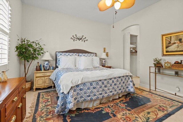 bedroom with ceiling fan and lofted ceiling