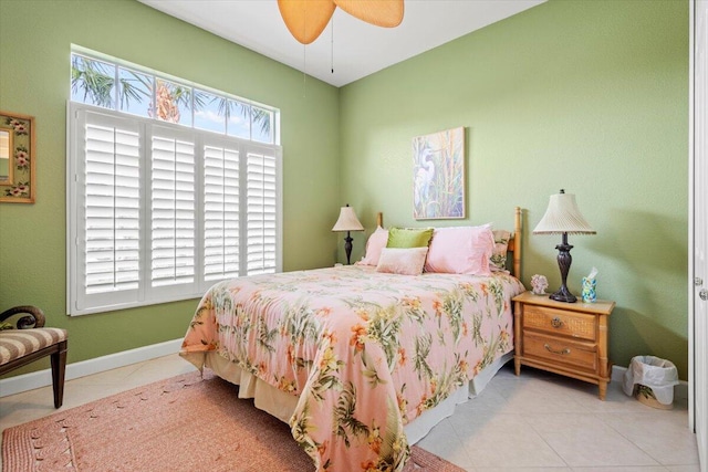 tiled bedroom with ceiling fan