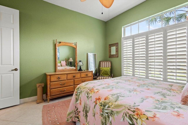 bedroom featuring ceiling fan and light tile patterned flooring