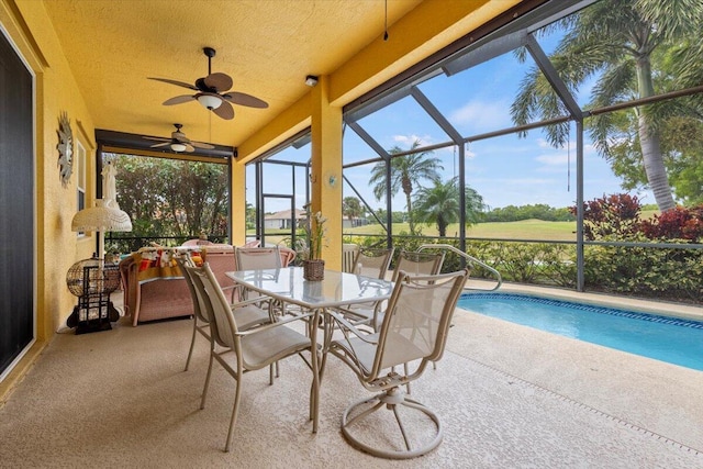 sunroom / solarium featuring ceiling fan