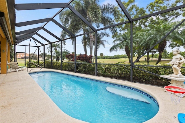 view of pool with a lanai and a patio area