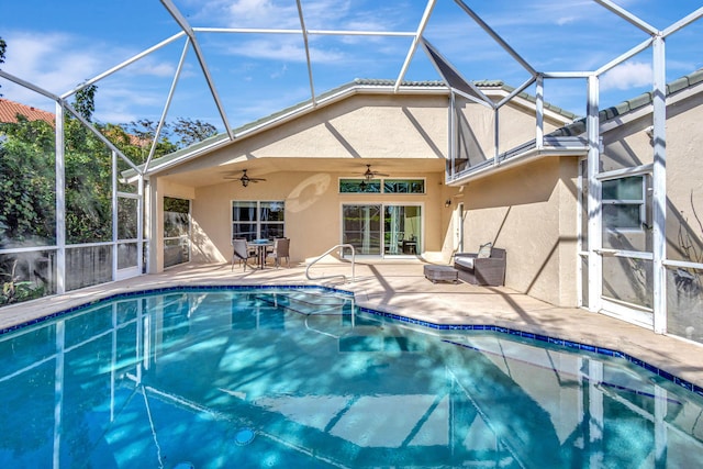 view of pool featuring a patio, ceiling fan, and a lanai