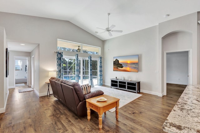 living room with ceiling fan, dark hardwood / wood-style floors, and lofted ceiling