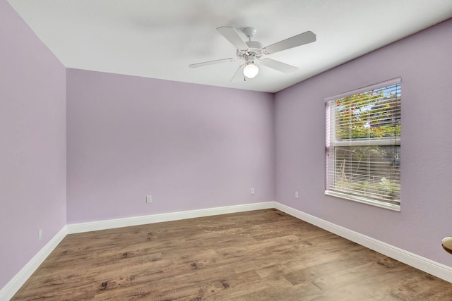 spare room with ceiling fan and hardwood / wood-style floors