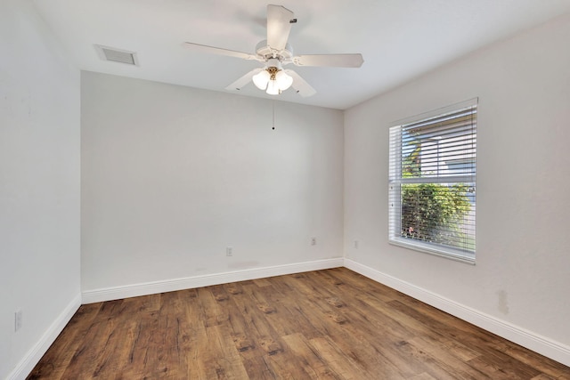 spare room featuring ceiling fan and wood-type flooring